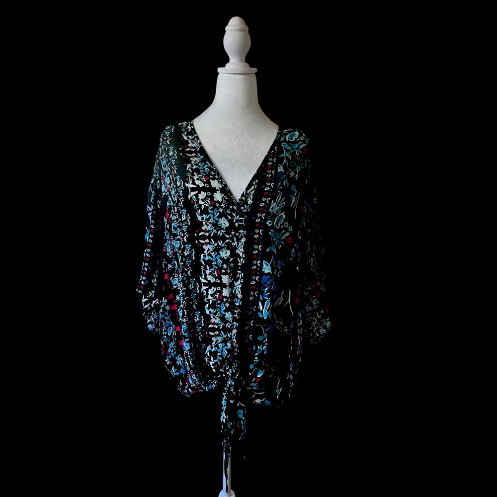 Women’s rayon lightweight V-neck pullover blouse.